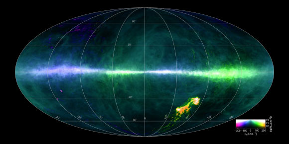 This HI4PI map was produced using data from the 100-m Max-Planck radio telescope in Effelsberg, Germany and the 64-m CSIRO radio telescope in Parkes, Australia. The image colors reflect gas at differing velocities. The plane of the Milky Way Galaxy runs horizontally across the middle of the image. The Magellanic Clouds can be seen at the lower right. Image credit: Benjamin Winkel / HI4PI Collaboration.