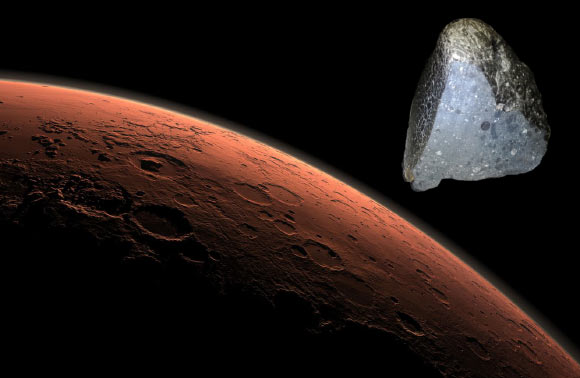 This computer-generated view depicts part of Mars at the boundary between darkness and daylight. At top right is NWA 7034. Image credit: NASA / JPL-Caltech / University of New Mexico / Sci-News.com.