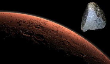 This computer-generated view depicts part of Mars at the boundary between darkness and daylight. At top right is NWA 7034. Image credit: NASA / JPL-Caltech / University of New Mexico / Sci-News.com.