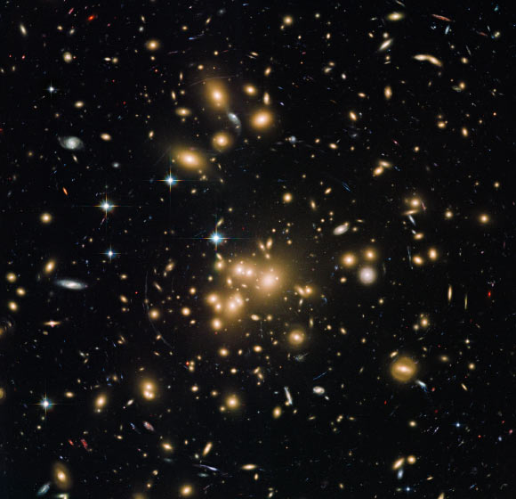 Hubble view of the galaxy cluster Abell 1689. Image credit: NASA / ESA / Hubble Heritage Team / STScI / AURA / J. Blakeslee, Dominion Astrophysical Observatory / H. Ford, JHU.