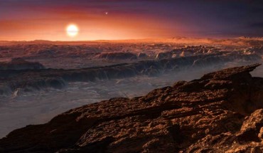 This artist’s impression shows a view of the surface of Proxima b orbiting Proxima Centauri. Alpha Centauri AB also appears in the image to the upper-right of Proxima itself. Proxima b is a little more massive than the Earth and orbits in the habitable zone around its star, where the temperature is suitable for liquid water to exist on its surface. Image credit: M. Kornmesser / ESO.