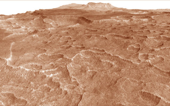 This vertically exaggerated view shows scalloped depressions in a part of Mars where such textures prompted researchers to check for buried ice, using the ground-penetrating SHARAD instrument. Image credit: NASA / JPL-Caltech / University of Arizona.