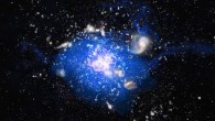 B.H.C. Emonts et al found that the Spiderweb, a massive galaxy in the center of a distant protocluster, is forming from a large reservoir of molecular gas. In this artist’s conception of the protocluster, the protogalaxies are shown in white and pink, and the blue indicates the location of the carbon monoxide gas. Image credit: M. Kornmesser / ESO.