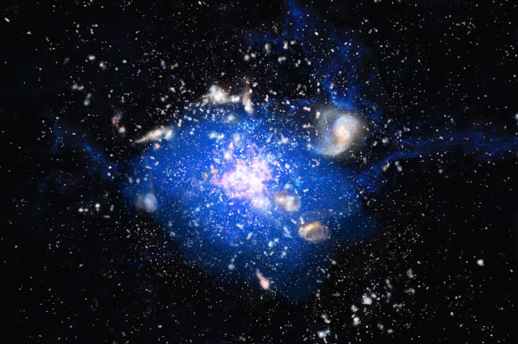 B.H.C. Emonts et al found that the Spiderweb, a massive galaxy in the center of a distant protocluster, is forming from a large reservoir of molecular gas. In this artist’s conception of the protocluster, the protogalaxies are shown in white and pink, and the blue indicates the location of the carbon monoxide gas. Image credit: M. Kornmesser / ESO.