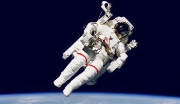 Astronaut Bruce McCandless II, STS 41-B mission specialist, participates in a historical spacewalk. He is pictured a few meters away from the cabin of the Earth-orbiting Space Shuttle Challenger. This spacewalk represented the first use of a nitrogen-propelled, hand-controlled device called the Manned Maneuvering Unit (MMU), which allows for much greater mobility than that afforded previous space walkers who had to use restrictive tethers. Image credit: NASA.