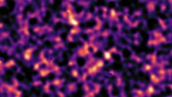 This map of dark matter was obtained from data from the KiDS survey, using ESO’s VLT Survey Telescope. It reveals an expansive web of dense (light) and empty (dark) regions. This image is one out of five patches of the sky observed by KiDS. The invisible dark matter is seen rendered in pink, covering an area of sky around 420 times the size of the full Moon. This image reconstruction was made by analyzing the light collected from over 3 million galaxies more than 6 billion light-years away. The observed galaxy images were warped by the gravitational pull of dark matter as the light traveled through the Universe. Some small dark regions, with sharp boundaries, appear in this image. They are the locations of bright stars and other nearby objects that get in the way of the observations of more distant galaxies and are hence masked out in the map as no weak-lensing signal can be measured in these areas. Image credit: Kilo-Degree Survey Collaboration / H. Hildebrandt & B. Giblin / ESO.