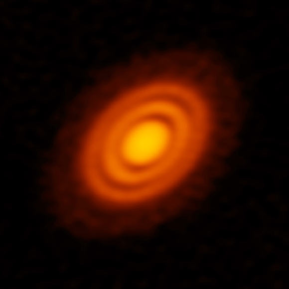 ALMA image of the protoplanetary disk surrounding the young star HD 163296 as seen in dust. New observations suggested that two planets are in orbit around the star. These planets, which are not yet fully formed, revealed themselves by the dual imprint they left in both the dust and the gas portions of the star’s protoplanetary disk. Image credit: ALMA / ESO / NAOJ / NRAO / AUI / NSF / A. Isella / B. Saxton.