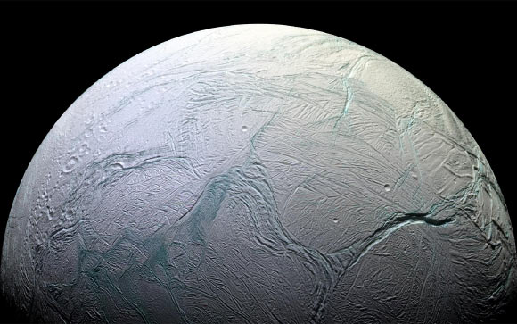 Enceladus is an icy world much like Hoth, except that it may have an ocean under its frozen crust. Astronomers believe this moon of Saturn may be a good candidate for having extraterrestrial life beneath its surface. Image credit: NASA.