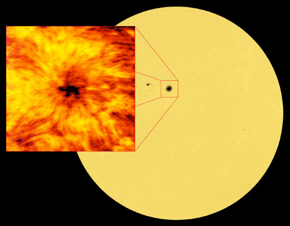 This image of the entire Sun was taken in the red visible light emitted by iron atoms in the Sun’s atmosphere. Light at this wavelength originates from the visible solar surface, the photosphere. A cooler, darker sunspot is clearly visible in the disc, and as a visual comparison is shown alongside the image from ALMA at a wavelength of 1.25 mm. The full-disc solar image was taken with the Helioseismic and Magnetic Imager (HMI) on board NASA’s Solar Dynamics Observatory. Image credit: ALMA / ESO / NAOJ / NRAO / NASA.