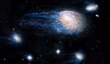 An artist’s impression showing the increasing effect of ram-pressure stripping in removing gas from the spiral galaxy NGC 4921 and its satellite galaxies. Image credit: ICRAR / NASA / ESA / Hubble Heritage Team / STScI / AURA.