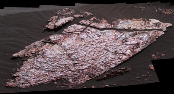 This view of a Martian rock slab called ‘Old Soaker,’ which has a network of cracks that may have originated in drying mud, comes from the Mast Camera on NASA’s Curiosity Mars rover. The location is within an exposure of Murray formation mudstone on lower Mount Sharp inside Gale Crater. Mud cracks would be evidence of a time more than 3 billion years ago when dry intervals interrupted wetter periods that supported lakes in the area. Several images from Mast Camera’s left-eye camera are combined into this mosaic view. They were taken on Dec. 20, 2016, during the 1,555th sol of Curiosity’s work on Mars. The Old Soaker slab is about 4 feet (1.2 m) long. Image credit: NASA / JPL-Caltech / MSSS.