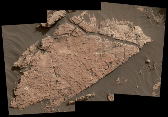 The network of cracks in Old Soaker may have formed from the drying of a mud layer more than 3 billion years ago. The view spans about 4 feet (1.2 m) left-to-right and combines three images taken by the Mars Hand Lens Imager (MAHLI) camera on the arm of Curiosity. Mud cracks would be evidence of a time when dry intervals interrupted wetter periods that supported lakes in the area. MAHLI was positioned about 3 feet (90 cm) above the surface when it took the component images on Dec. 31, 2016, during the 1,566th sol of Curiosity’s work on Mars. This observation was planned as part of assessing a hypothesis that the target preserves evidence of drying mud. The slab bears a network of four- and five-sided polygons about half an inch to 1 inch (1 to 2 cm) across, which matches the pattern commonly formed when a thin layer of mud dries.  Some edges of the polygons are ridges of material the same color as the surrounding rock. The target rock’s name comes from the name of an island off the coast of Maine. The names informally assigned by the rover team to features in the area of lower Mount Sharp that includes this slab are from a list of islands, hills and other sites in or near Maine’s Bar Harbor. Image credit: NASA / JPL-Caltech / MSSS.