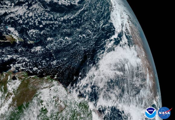 The Saharan Dust Layer can be discerned in the far right edge of this image of Earth. This dry air from the coast of Africa can have impacts on tropical cyclone intensity and formation. Image credit: NOAA / NASA.