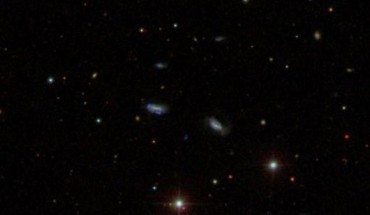 This SDSS image shows a group of dwarf galaxies that are gravitationally bound together. The detection of seven such groups lends support to the idea that large galaxies formed by the collision and merger of smaller galaxies in the early Universe. Image credit: Sloan Digital Sky Survey.