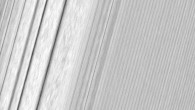 This Cassini image features a density wave in Saturn’s A ring (at left) that lies around 83,575 miles (134,500 km) from Saturn. Density waves are accumulations of particles at certain distances from the planet. This feature is filled with clumpy perturbations, which researchers informally refer to as ‘straw.’ The wave itself is created by the gravity of Saturn’s moons Janus and Epimetheus, which share the same orbit around the gas giant. Elsewhere, the scene is dominated by ‘wakes’ from a recent pass of the ring moon Pan. The image was taken in visible light with Cassini’s wide-angle camera on December 18, 2016. The view was obtained at a distance of approximately 34,000 miles (56,000 km) from the rings and looks toward the unilluminated side of the rings. Image credit: NASA / JPL-Caltech / Space Science Institute.
