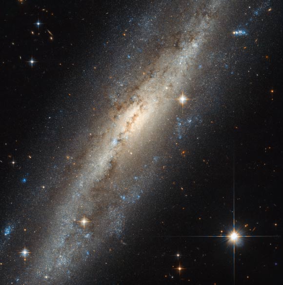 This Hubble image shows the barred spiral galaxy NGC 7640, which lies in the constellation Andromeda, about 38.8 million light-years away. Image credit: NASA / ESA / Hubble.