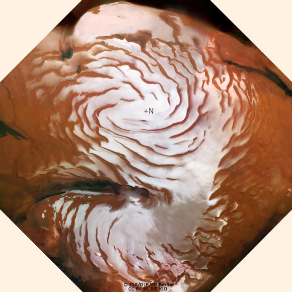 Mars’ north polar ice cap. The position of the north pole is marked. Image credit: ESA / DLR / FU Berlin / CC BY-SA 3.0 IGO.