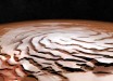 Perspective view of Mars’ north polar ice cap and its distinctive dark troughs forming a spiral-like pattern. The view is based on images taken by ESA’s Mars Express and generated using elevation data from the Mars Orbiter Laser Altimeter on board NASA’s Mars Global Surveyor. Image credit: ESA / DLR / FU Berlin / NASA / MGS / MOLA Science Team.