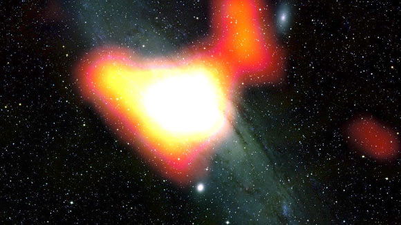 NASA’s Fermi telescope has detected a gamma-ray excess (shown in yellow-white) at the center of the Andromeda galaxy that’s similar to a signature Fermi previously detected at the center of our own Milky Way Galaxy. Scientists think the signal could be produced by a variety of processes, including a population of pulsars or even dark matter. Image credit: NASA / DOE / Fermi LAT Collaboration / Bill Schoening / Vanessa Harvey / REU Program / NOAO / AURA / NSF.