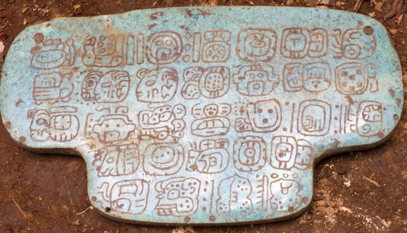 The Maya jade pendant is inscribed with 30 hieroglyphs. The jade stone itself is from the mountains of Guatemala, southwest of Belize. Image credit: Geoffrey Braswell, University of California, San Diego.