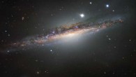 This VLT image shows the spiral galaxy NGC 1055. This large galaxy appears to lack the whirling arms characteristic of a spiral, as it is seen edge-on; however, it displays odd twists in its structure that were probably caused by an interaction with a large neighboring galaxy, Messier 77. The VLT observed NGC 1055 with the FOcal Reducer and low dispersion Spectrograph 2 (FORS2) instrument using visible-light filters. Image credit: ESO.