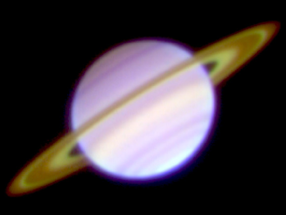 This is a three-color composite image of Saturn and its rings taken January 23, 2008 with the COMICS instrument on the Subaru Telescope. The Cassini Division and the C ring appear bright. Color differences reflect the temperatures; the warmer part is blue, the cooler part is red. Image credit: NAOJ.