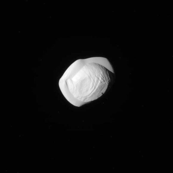 This image of Pan was taken during the close flyby of Cassini on March 7, 2017, received on Earth March 8. The flyby had a close-approach distance of 15,268 miles (24,572 km). Cassini’s camera was pointing toward Pan, and the image was taken using the CL1 and GRN filters. Image credit: NASA / JPL-Caltech / Space Science Institute.
