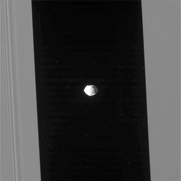This image of Pan was taken during the close flyby of Cassini on March 7, 2017, received on Earth March 8. The flyby had a close-approach distance of 15,268 miles (24,572 km). Cassini’s camera was pointing toward Pan, and the image was taken using the CL1 and CL2 filters. Image credit: NASA / JPL-Caltech / Space Science Institute.