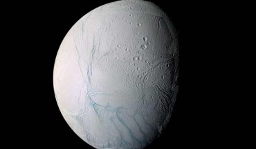This enhanced-color view of Enceladus is largely of the southern hemisphere and includes the south polar terrain at the bottom of the image. Ancient craters remain somewhat pristine in some locales, but have clearly relaxed in others. Northward-trending fractures, likely caused by a change in the moon’s rate of rotation and the consequent flattening of the moon’s shape, rip across the southern hemisphere. The south polar terrain is marked by a striking set of ‘blue’ fractures and encircled by a conspicuous and continuous chain of folds and ridges, testament to the forces within Enceladus that have yet to be silenced. The mosaic was created from 21 false-color frames taken during Cassini’s close approaches to Enceladus on March 9 and July 14, 2005. Images taken using filters sensitive to UV, visible and IR light (spanning wavelengths from 338 to 930 nm) were combined to create the individual frames. Image credit: NASA / JPL / Space Science Institute.