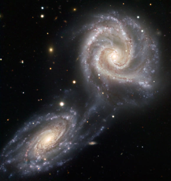 A present-day near-miss of two spiral galaxies NGC 5426 and NGC 5427, which may be comparable to the early flyby of the Andromeda galaxy past our own Milky Way Galaxy. Image credit: ESO.