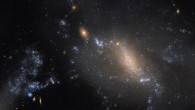 This Hubble image captures an ongoing cosmic collision between two galaxies: NGC 3447A and NGC 3447B. Image credit: NASA / ESA / Hubble.