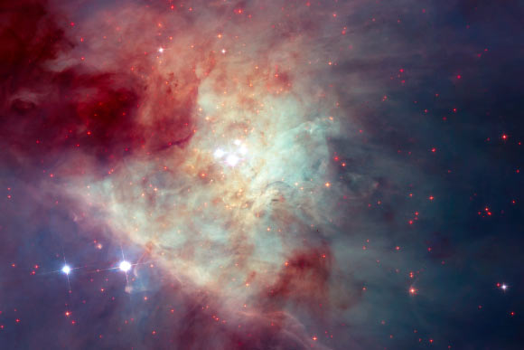 This composite image of the Kleinmann-Low Nebula is composed of several pointings of the NASA/ESA Hubble Space Telescope in optical and near-infrared light. The revealed stars are shown with a bright red color in the image. Image credit: NASA / ESA / Hubble.