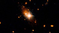 The elliptical galaxy 3C186, located about 8 billion years from Earth, is most likely the result of a merger of two galaxies. This is supported by arc-shaped tidal tails, usually produced by a gravitational tug between two colliding galaxies, identified by M. Chiaberge et al. The merger of the galaxies also led to a merger of the two supermassive black holes in their centers, and the resultant black hole was then kicked out of its parent galaxy by the gravitational waves created by the merger. The bright, star-like looking quasar can be seen in the center of the image. Its former host galaxy is the faint, extended object behind it. Image credit: NASA / ESA / M. Chiaberge, STScI.