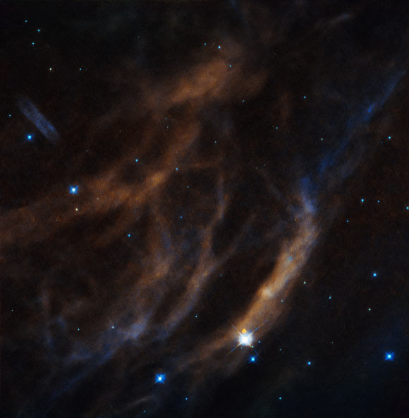 This Hubble image shows a few of the tenuous threads that comprise Sh2-308. Image credit: NASA / ESA / Hubble.