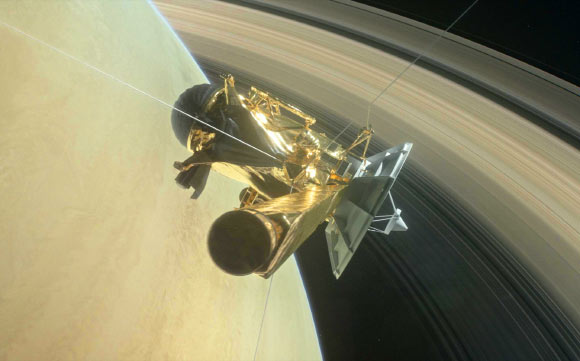 This illustration shows Cassini about to make one of its dives between Saturn and its innermost rings as part of the mission’s Grand Finale. Image credit: NASA / JPL-Caltech.