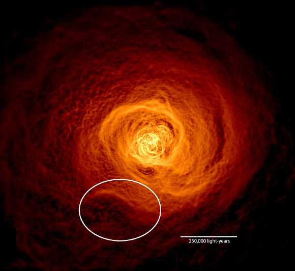 This X-ray image of the hot gas in the Perseus Cluster was made from 16 days of Chandra observations. An oval highlights the location of an enormous wave found to be rolling through the gas. Image credit: NASA’s Goddard Space Flight Center / Stephen Walker et al.