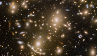 With the final observation of the distant galaxy cluster Abell 370 -- approximately 6 billion light-years away -- the Frontier Fields program came to an end. Abell 370 is one of the very first galaxy clusters in which astronomers observed the phenomenon of gravitational lensing, the warping of spacetime by the cluster’s gravitational field that distorts the light from galaxies lying far behind it. This manifests as arcs and streaks in the picture, which are the stretched images of background galaxies. Image credit: NASA / ESA / Hubble / HST Frontier Fields.