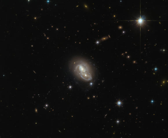This Hubble image shows the unusual object LEDA 18516. Image credit: NASA / ESA / Hubble.
