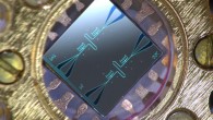 Photo of the centimeter-sized silicon chip, which has two parallel superconducting oscillators and the quantum-circuit refrigerators connected to them. Image credit: Kuan Yen Tan / Aalto University.