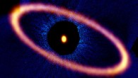 Composite image of the Fomalhaut star system. The ALMA data, shown in orange, reveal the distant and eccentric debris disk in never-before-seen detail. The central dot is the unresolved emission from the star, which is about twice the mass of our Sun. Optical data from the NASA/ESA Hubble Space Telescope is in blue; the dark region is a coronagraphic mask, which filtered out the otherwise overwhelming light of the central star. Image credit: ALMA / ESO / NAOJ / NRAO / M. MacGregor / NASA / ESA / Hubble / P. Kalas / B. Saxton / AUI / NSF.