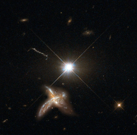 An artist’s impression of a quasar and neighboring merging galaxy. The galaxies observed by Decarli et al are so distant that no detailed images are possible at present. This combination of images of nearby counterparts gives an impression of how they might look in more detail. Image credit: Max Planck Institute for Astronomy / NASA / ESA / Hubble.