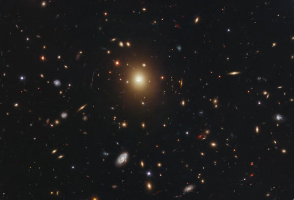 The giant elliptical galaxy in the center of this Hubble image is the most massive and brightest member of the galaxy cluster Abell 2261. Spanning a little more than one million light-years, the galaxy is about 10 times the diameter of the Milky Way Galaxy. Abell 2261 is located approximately 3 billion light-years away. Image credit: NASA / ESA / M. Postman, STScI / T. Lauer, NOAO / CLASH Team.