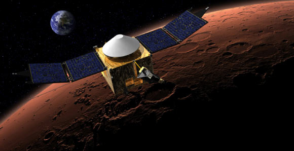 This artist’s concept shows MAVEN in orbit around Mars, with a fanciful image of Earth in the background. Image credit: NASA / GSFC.