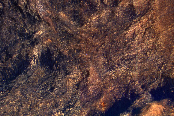 This color-enhanced view of NASA’s Curiosity rover was taken by the HiRISE instrument on NASA’s Mars Reconnaissance Orbiter as the satellite flew overhead. The image was acquired on June 5, 2017. The rover is about 10 feet long and not really as blue as it looks here. Image credit: NASA / JPL-Caltech / University of Arizona.