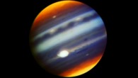 This composite, false-color infrared image of Jupiter reveals haze particles over a range of altitudes, as seen in reflected sunlight. It was taken using the Gemini North telescope’s Near-InfraRed Imager (NIRI) on May 18, 2017. The multiple filters corresponding to each color used in the image cover wavelengths between 1.69 microns and 2.275 microns. Jupiter’s Great Red Spot (GRS) appears as the brightest (white) region at these wavelengths, which are primarily sensitive to high-altitude clouds and hazes near and above the top of Jupiter's convective region. The GRS is one of the highest-altitude features in Jupiter’s atmosphere. Narrow spiral streaks that appear to lead into it or out of it from surrounding regions probably represent atmospheric features being stretched by the intense winds within the GRS, such as the hook-like structure on its western edge (left side). Some are being swept off its eastern edge (right side) and into an extensive wave-like flow pattern, and there is even a trace of flow from its northern edge. Other features near the GRS include the dark block and dark oval to the south and the north of the eastern flow pattern, respectively, indicating a lower density of cloud and haze particles in those locations. Both are long-lived cyclonic circulations, rotating clockwise -- in the opposite direction as the counterclockwise rotation of the GRS. A prominent wave pattern is evident north of the equator, along with two bright ovals, which are anticyclones that appeared in January 2017. Both the wave pattern and the ovals may be associated with an impressive upsurge in stormy activity that has been observed in these latitudes this year. Another bright anticyclonic oval is seen further north. High hazes are evident over both polar regions with much spatial structure not previously been seen quite so clearly in ground-based images. Image credit: Gemini Observatory / AURA / NASA / JPL-Caltech.
