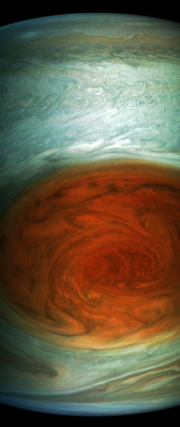 This enhanced-color image of the Great Red Spot was created by citizen scientist Gerald Eichstaedt using data from the JunoCam imager on NASA’s Juno spacecraft. The image is approximately illumination adjusted and strongly enhanced to draw viewers’ eyes to the iconic storm and the turbulence around it. At the time the image was taken, the spacecraft was about 6,130 miles (9,866 km) from the tops of the clouds of the planet. Image credit: NASA / JPL-Caltech / SwRI / MSSS / Gerald Eichstaedt.