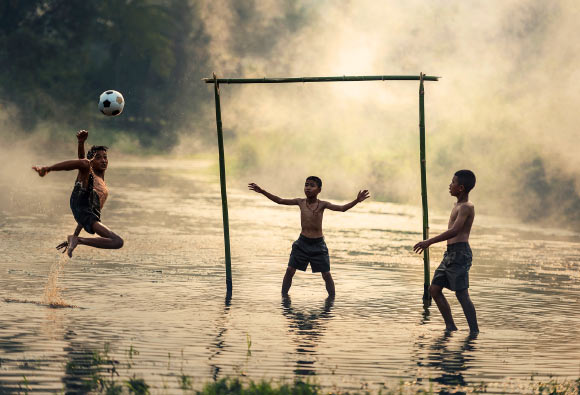 According to Vlachopoulos et al, bone acquisition is higher in adolescent male soccer players compared to swimmers and cyclists at the femoral neck and lumbar spine sites of the skeleton. Image credit: Sasin Tipchai.