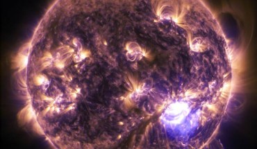 NASA’s Solar Dynamics Observatory captured an X-class solar flare erupting on the Sun on December 19, 2014. This image blends two wavelengths of extreme UV light, 171 (gold) and 131 (purple). Image credit: NASA / SDO / Duberstein.