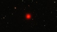 Ross 128 (center), also known as HIP 57548 or IRAS 11451+0105, is a red dwarf star. It has 15% of the mass of the Sun and 21% of the Sun’s radius, but generates energy so slowly that it has only 0.036% of the Sun’s visible luminosity. Image credit: Sloan Digital Sky Survey.