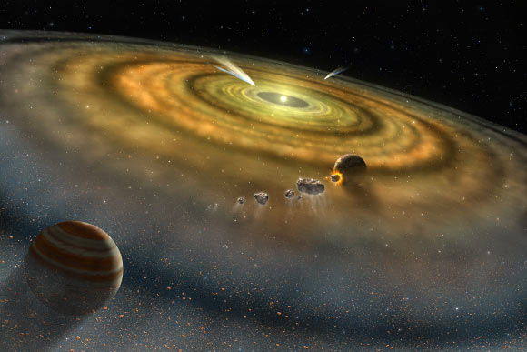 Artist’s conception of the dust and gas surrounding a newly formed planetary system. Image credit: NASA.